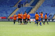 FSD Academy players celebrate scoring a goal at the King Power Stadium.